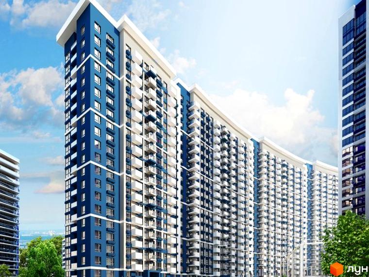 Житловий комплекс Зарічний - це сучасна новобудова з синьо-білими фасадами та численними балконами. Навколо комплексу зелені дерева та блакитне небо з хмарами.