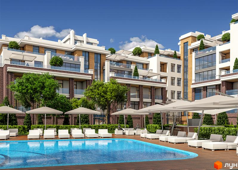 Житловий комплекс Comfort City з басейном та шезлонгами. Сучасна архітектура будівель з цегляним оздобленням та скляними балконами.