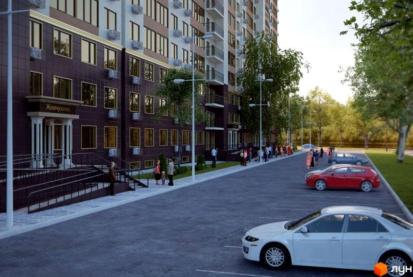 Житловий комплекс «Жемчужина». Багатоповерховий будинок з темним фасадом та великими вікнами. На прибудинковій території є парковка та зелені насадження.