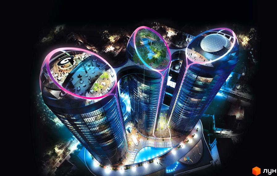 Taryan Towers - три висотні будівлі з футуристичними овальними дахами, що світяться. Навколо них басейн та зелені зони.