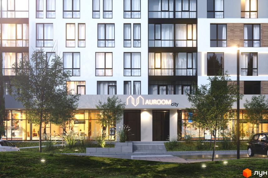 Фасад житлового комплексу AUROOM CITY з білими стінами та великими вікнами. Перед будинком зелені насадження, доріжки та освітлення.