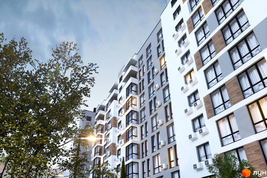 Житловий комплекс AUROOM CITY: багатоповерховий будинок з біло-сірим фасадом, вікнами та кондиціонерами. Перед ним зелені дерева.