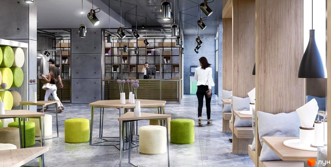 Інтер'єр громадської зони Житлового комплексу Вільне Місто з дерев'яними столами, пуфами та людьми.