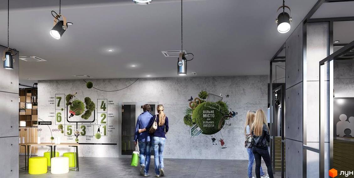 Інтер'єр холу Житлового комплексу Вільне Місто: бетонні стіни, високі стелі, яскраві графіті та зони відпочинку.