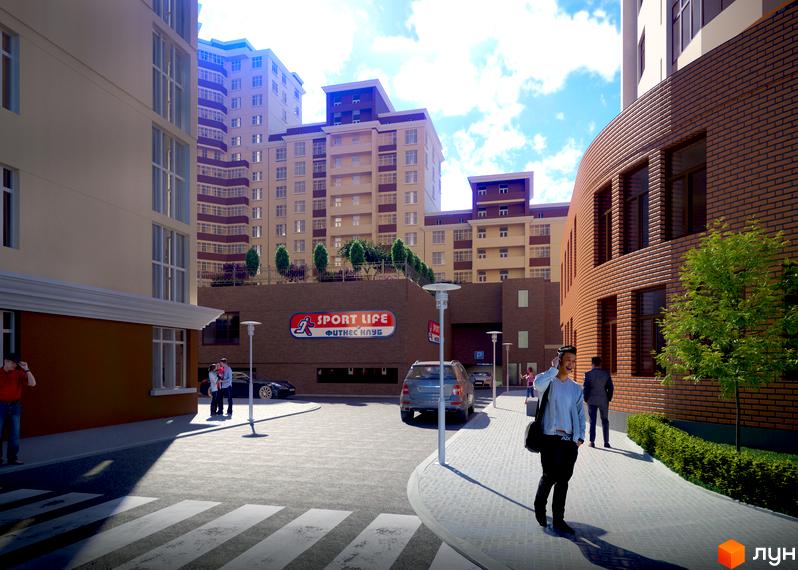 Зовнішній вигляд житлового комплексу Авіа Квартал з прибудинковою територією та пішоходами на вулиці.