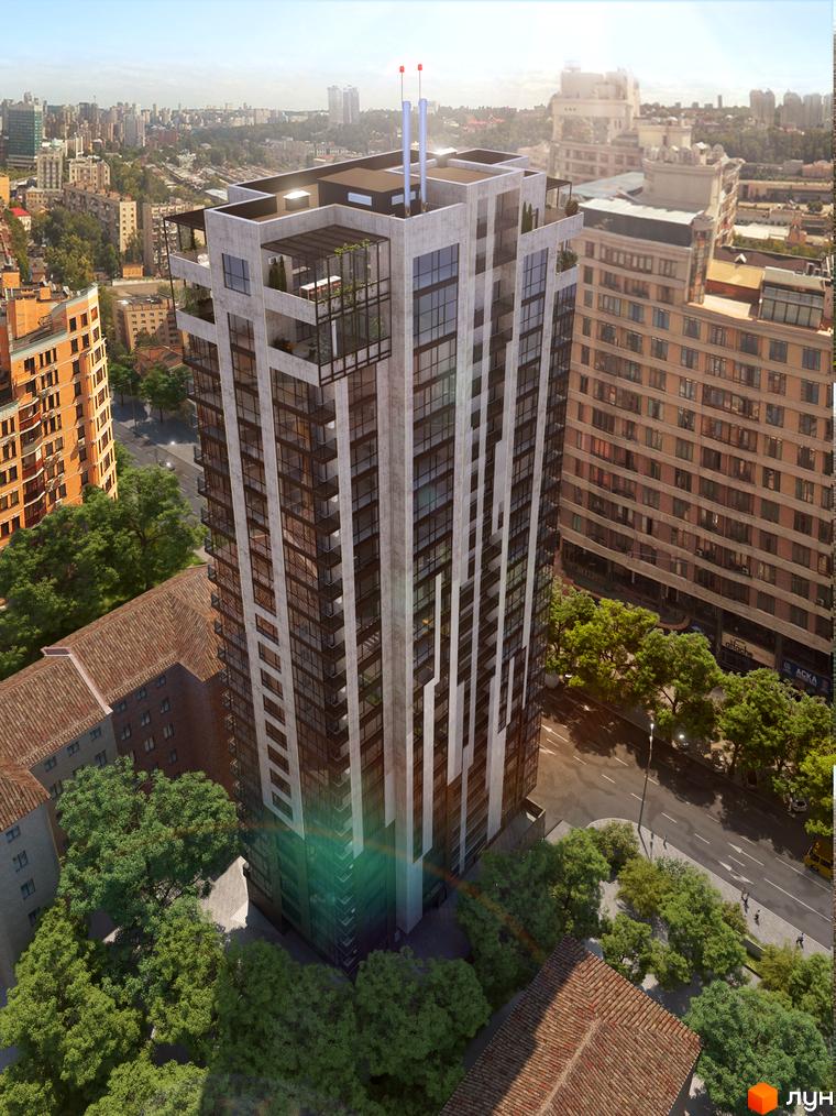 Висотна будівля ЖК AuRoom з панорамним склінням. Навколо будинку зелені дерева та дорога.