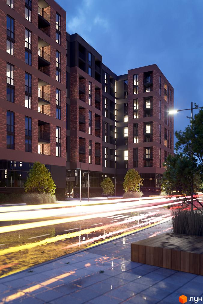 Зображення фасаду житлового району Avalon Zelena Street вночі. Вигляд будинку з червоної цегли, освітлена прибудинкова територія.