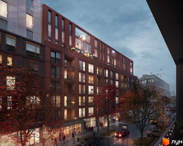 Житловий район Rybalsky - це цегляна новобудова з балконами та великими вікнами. Навколо будівлі розташовані дерева з осіннім листям та міська вулиця з автомобілями.