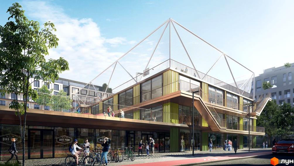 Будівля Житлового району Rybalsky з жовто-зеленими панелями, терасами та сітчастою конструкцією на даху. На першому поверсі магазини Bike Park та люди.