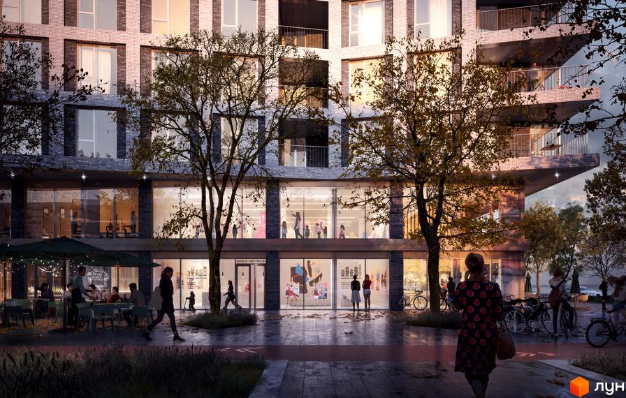 Житловий район Rybalsky з темним фасадом та великими вікнами. На перших поверхах комерційні приміщення, поруч кафе та пішохідна зона з деревами.