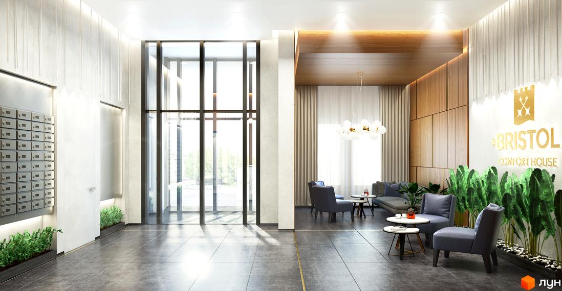 Вхідна група Житлового комплексу Bristol Comfort House з великими скляними дверима, просторим лобі, зоною відпочинку та поштовими скриньками.