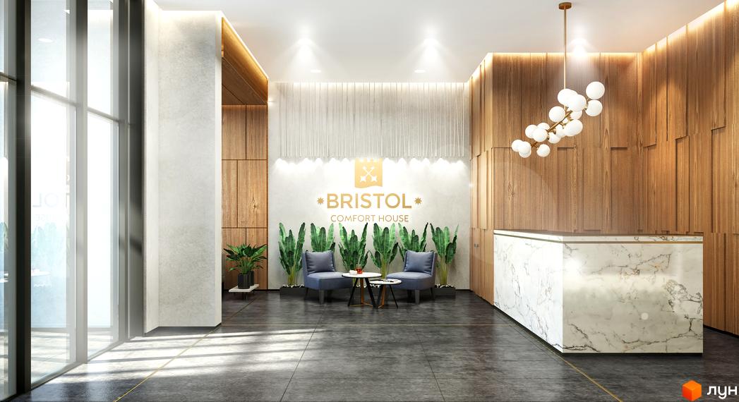 Інтер'єр лобі житлового комплексу Bristol Comfort House з мармуровою рецепцією, зоною очікування та дерев'яними стінами.