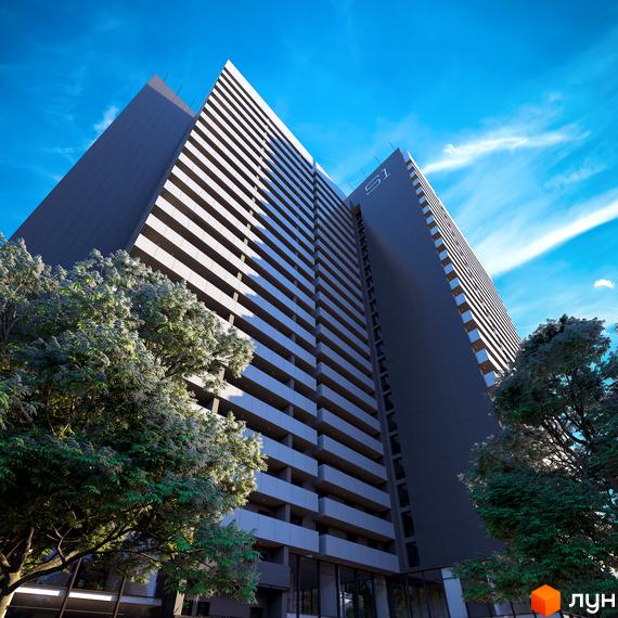 Зображення багатоповерхового будинку Житлового комплексу Standard One з великими вікнами та балконами. Навколо будівлі ростуть дерева.