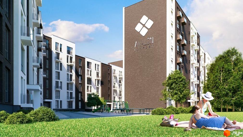 Новобудова Avalon Comfort з білими та коричневими фасадами, скляними балконами та зеленою прибудинковою територією з дитячим майданчиком.