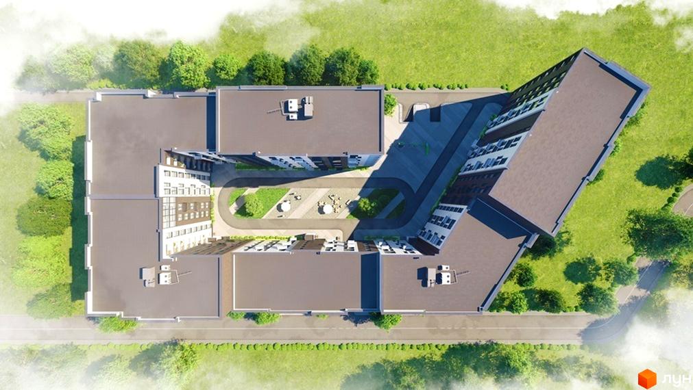 Вид зверху на житловий комплекс Avalon Comfort з корпусами П-подібної форми та внутрішнім двориком з зонами відпочинку. Навколо комплексу зелена територія з деревами та дорогою.