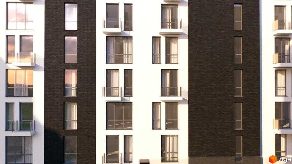 Фасад житлового комплексу Avalon Comfort з великими вікнами та балконами. Будинок має білі та темні цегляні секції, що створює контрастний вигляд.