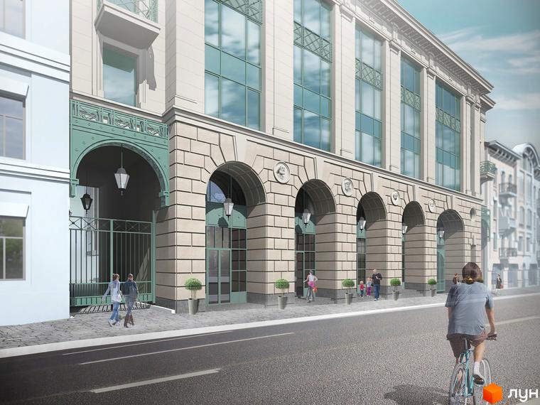 Житловий комплекс Ярославів Град. Фасад будівлі з арками та великими вікнами. Біля будинку розташовані зелені насадження та тротуар.