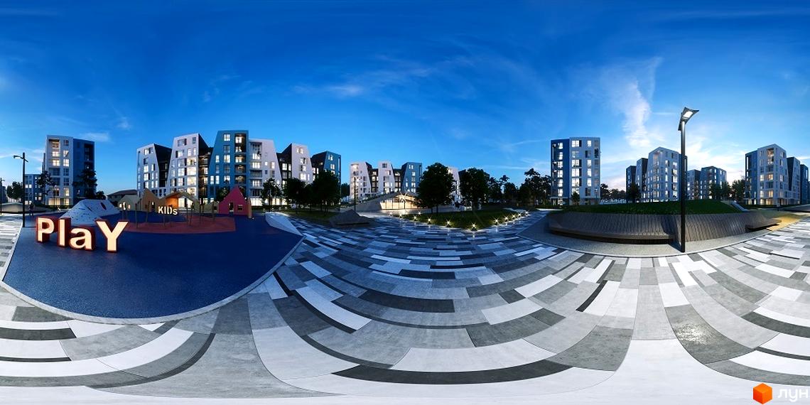 Житловий комплекс Vlasna ввечері: багатоповерхові будинки з освітленими вікнами та простора прибудинкова територія з дитячим майданчиком і ландшафтним дизайном.