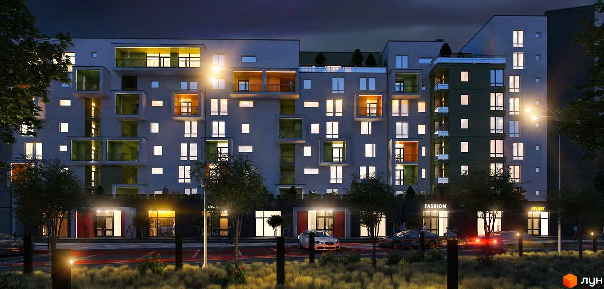 Житловий комплекс Квартал Віденський. Зовнішній вигляд новобудови з численними балконами та вікнами, що світяться ввечері. Навколо будинку розташовані дерева та освітлена вулиця з автомобілями.