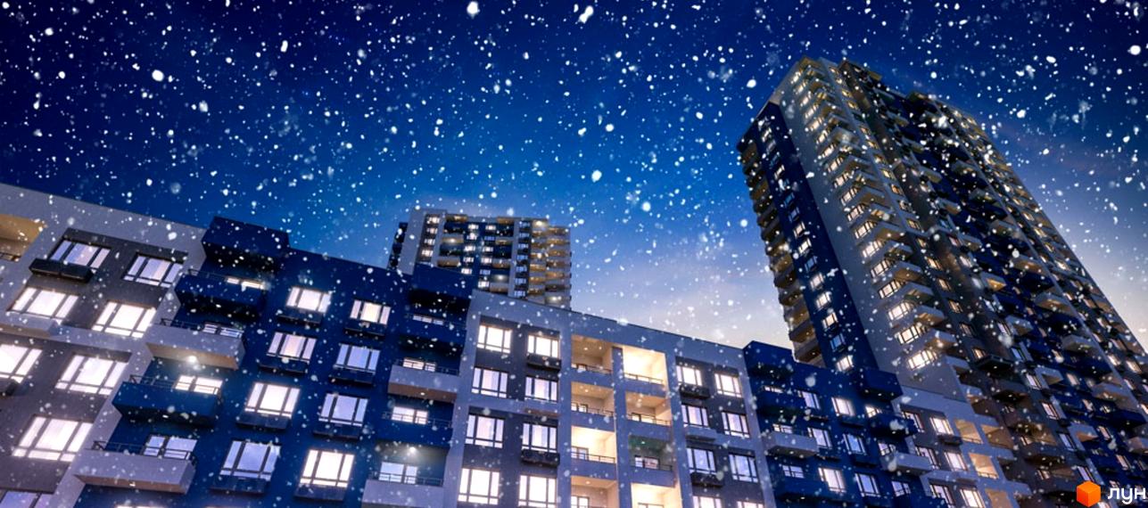Зовнішній вигляд житлового комплексу Воздухофлотський квартал взимку під час снігопаду. Багатоповерхові будинки з підсвіченими вікнами та балконами.