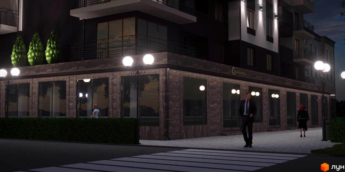 Зовнішній вигляд новобудови ЖК Парковий вночі. Озеленена територія та люди на вулиці.