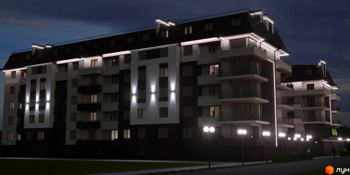 Зовнішній вигляд житлового комплексу Парковий вночі з підсвіченими фасадами та ліхтарями на території. Новобудова з балконами та мансардним дахом.