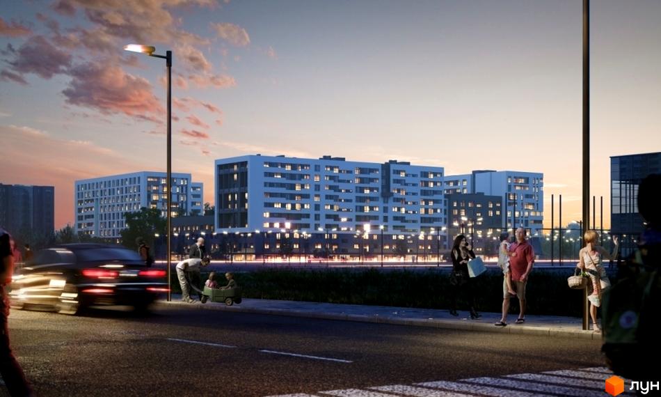 Зовнішній вигляд житлового комплексу Місто Трав з сучасними фасадами та освітленням. На прибудинковій території видно людей, що прогулюються, та транспорт.