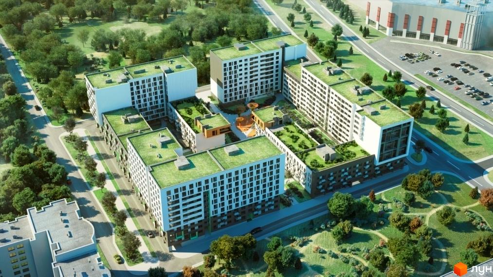 Зовнішній вигляд житлового комплексу Місто Трав з зеленими дахами та внутрішнім двориком. Навколо комплексу розташовані дерева та доглянута прибудинкова територія.