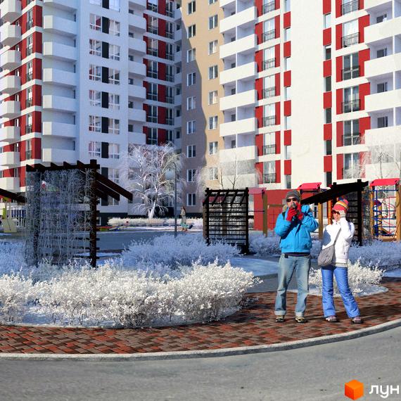 Багатоповерхові будинки Житлового комплексу Сакура з білими та червоними фасадами. Зимовий двір з засніженими кущами, деревами та дитячим майданчиком.