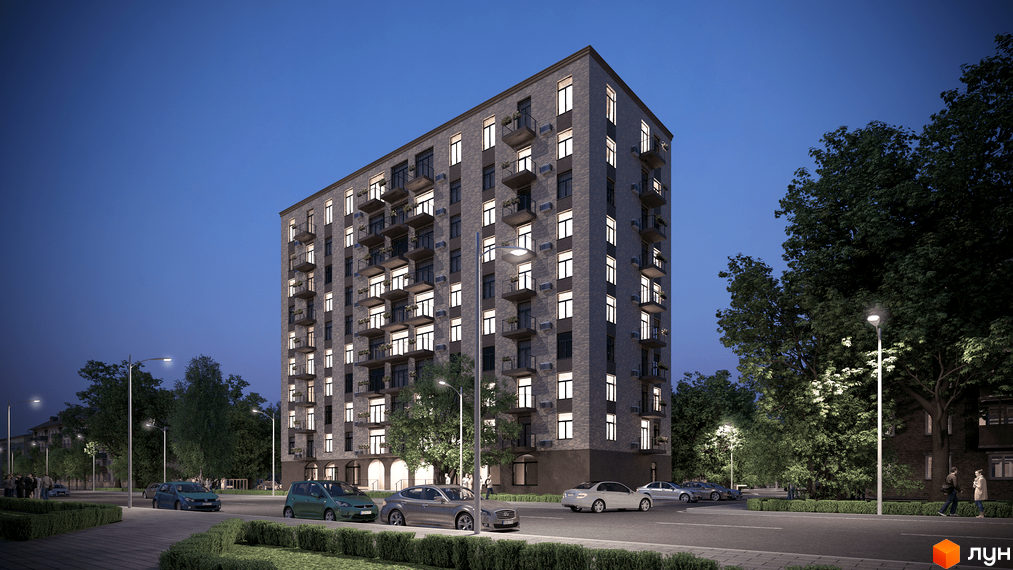 Житловий комплекс Освіти, 14. Зовнішній вигляд будинку з балконами та вікнами, що світяться ввечері. Прибудинкова територія з деревами та дорогою.