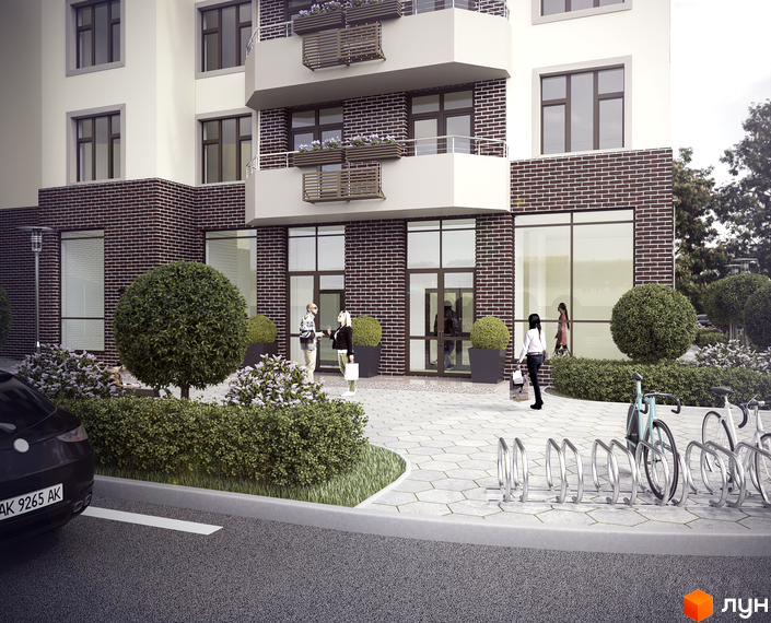 Апарт-комплекс Електриків: фасади будинку з цегляним оздобленням та великими вікнами. Прибудинкова територія з ландшафтним дизайном та велопарковкою.