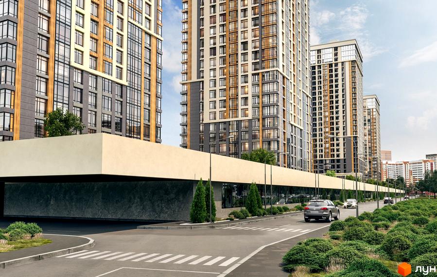 Зовнішній вигляд житлового комплексу Урлівський-1 з високими будівлями та зеленою прибудинковою територією. На зображенні видно дорогу з автомобілями та пішохідний перехід.