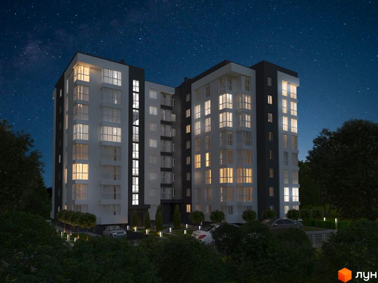 Зображення фасаду Житлового комплексу Kaiser Comfort вночі. Багатоповерховий будинок з освітленими вікнами та прибудинковою територією.