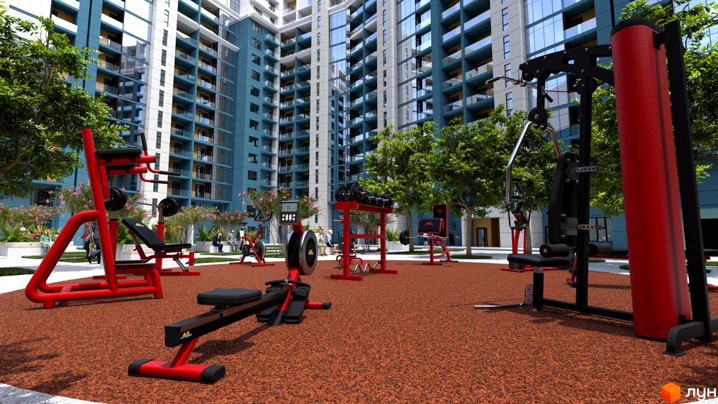 Житловий комплекс National. Багатоповерхові будинки з великими вікнами. На території комплексу розташований відкритий спортивний майданчик з тренажерами.