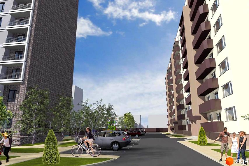 Зовнішній вигляд житлового комплексу на вул. Ігоря Сердюка, 19, з цегляним фасадом та балконами. Прибудинкова територія з деревами та парковкою.