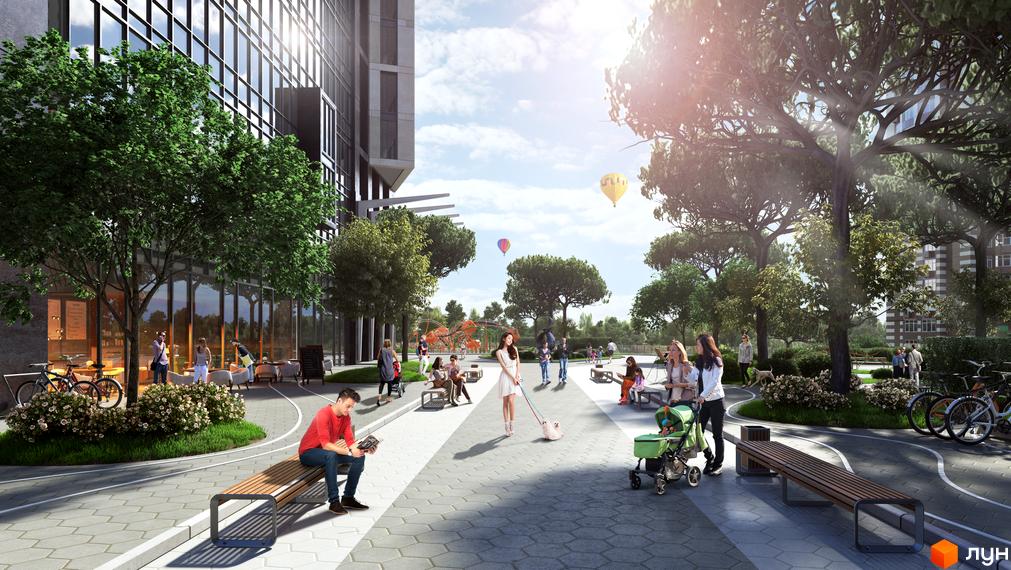 Житловий комплекс Greenville Park з сучасною архітектурою та зеленою прибудинковою територією, де люди відпочивають на лавках та гуляють з дітьми.