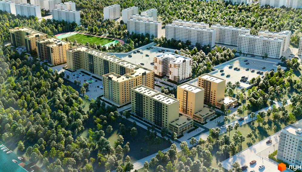 Зображення Житлового комплексу Олімпійський 2 з висоти пташиного польоту. На фото будівлі та зелена прибудинкова територія з парковкою.