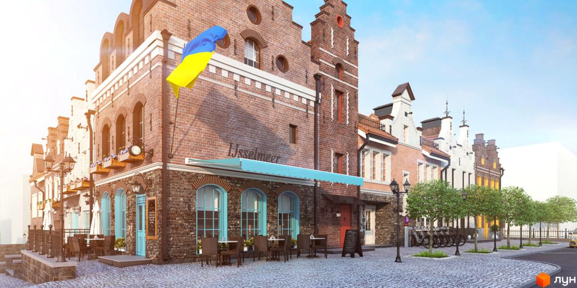 Таунхауси Luxembourg з фасадом з червоної цегли. Перед будинком мощена бруківкою пішохідна зона з лавками та ліхтарями.