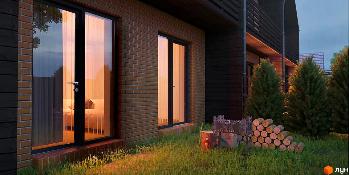 Зовнішній вигляд таунхаусів «Уют плюс 2». Цегляна кладка, панорамні вікна, зелена прибудинкова територія з місцем для відпочинку.