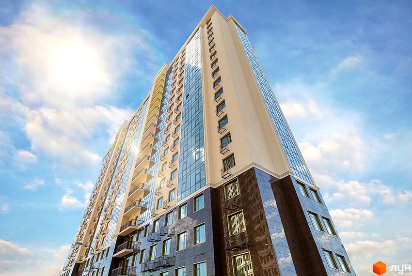 Високий житловий комплекс Двадцять перша Перлина з панорамним склінням на тлі сонячного неба.