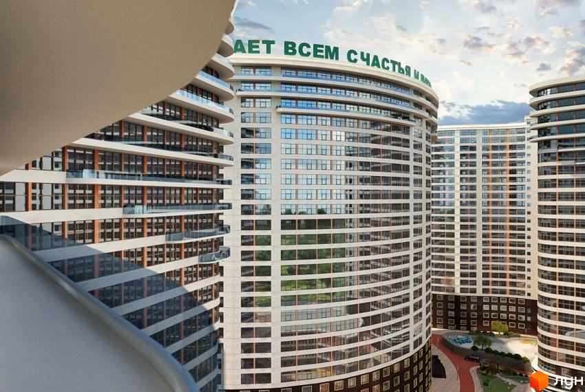 Житловий комплекс Сорок третя перлина з вигнутими фасадами та скляними балконами. На прибудинковій території розташований ландшафтний дизайн з зеленими зонами та місцями для відпочинку.