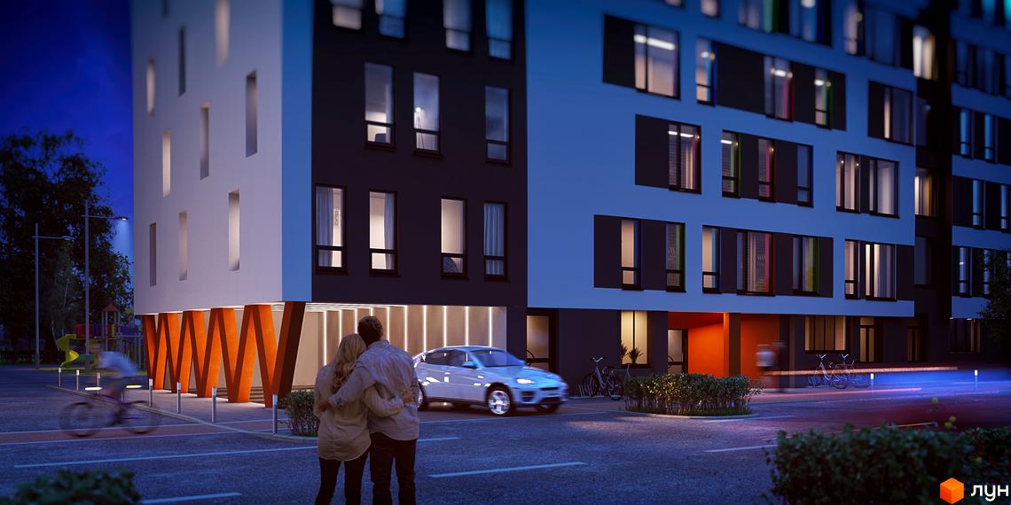 Житловий комплекс Яскравий Львів: багатоповерховий будинок з темними та світлими фасадами, прямокутними вікнами. Освітлена прибудинкова територія з пішохідними зонами та автомобілем.