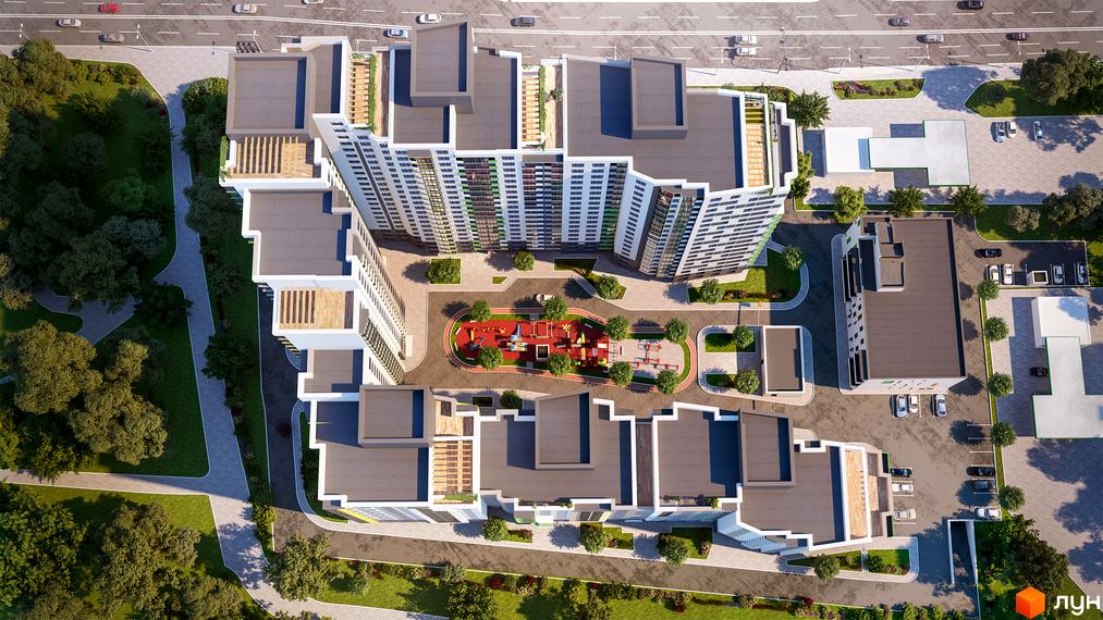 Житловий комплекс Харківський: вид зверху на багатоповерхові будинки та прибудинкову територію з дитячим майданчиком та парковкою.