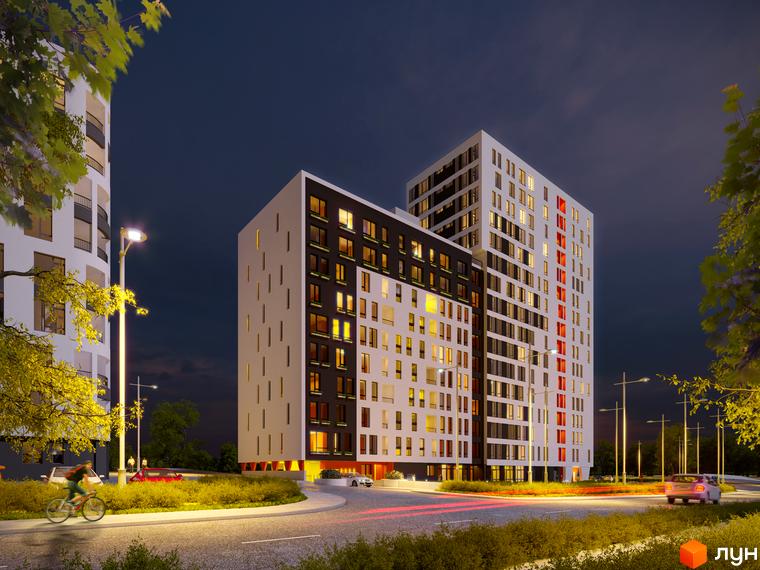 Новобудова Яскравий Львів вночі, з білими та темними фасадами, освітленими вікнами. На передньому плані дорога, зелені насадження та ліхтарі, що освітлюють територію.