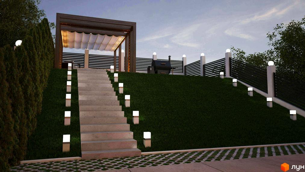 Освітлені сходи ведуть до зони відпочинку з перголою та мангалом на зеленій території Таунхаусів „Капітель“.