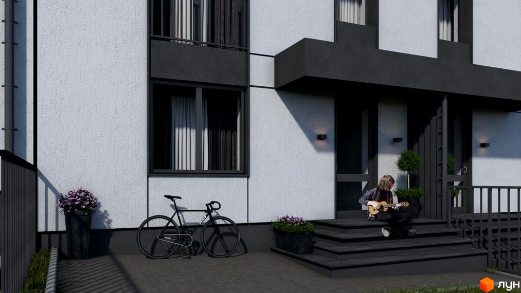 Зовнішній вигляд таунхаусів Smart Village з білою фасадною штукатуркою та чорними елементами. На прибудинковій території розташовані велосипед, клумба з квітами та людина, яка грає на гітарі.