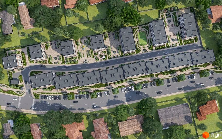 Житловий комплекс Kolibri: аерофотографія будівель з темними дахами, що оточені зеленими зонами, дитячими майданчиками та спортивним кортом.