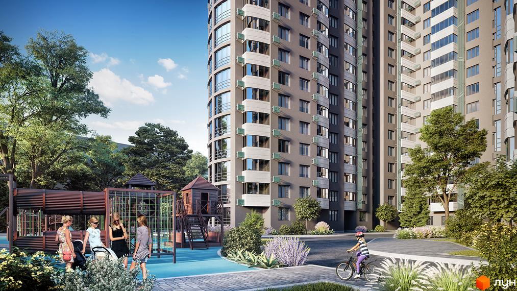 Багатоповерховий будинок ЖК FREEDOM з великими вікнами. На території комплексу дитячий майданчик та зелені насадження.