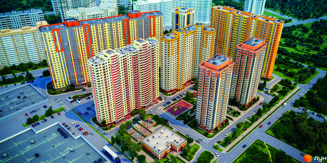 Вид на житловий комплекс Яскравий з висоти пташиного польоту. Багатоповерхові будинки жовто-помаранчевих кольорів з сірими вставками. Прибудинкова територія з дитячими майданчиками та парковками.