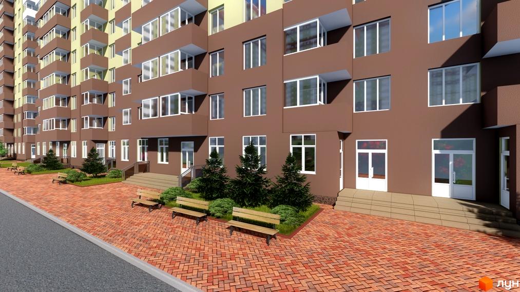 Зовнішній вигляд будинку житлового комплексу The Lakes з коричневим фасадом та балконами. Поруч розташована брукована прибудинкова територія з лавками та деревами.